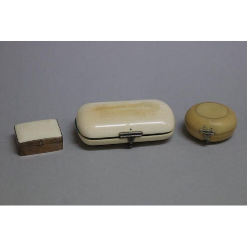 258 - Antique ivory coin purse, a small circular ivory box and silver and ivory pill box, approx 8cm W and... 