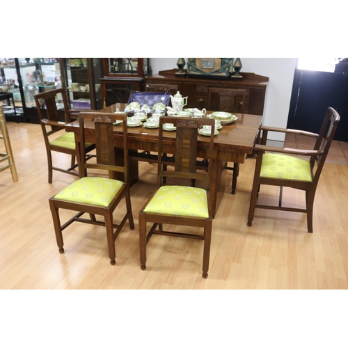 233 - Art Deco walnut dining suite comprising sideboard, six dining chairs & table, with relief carved det... 