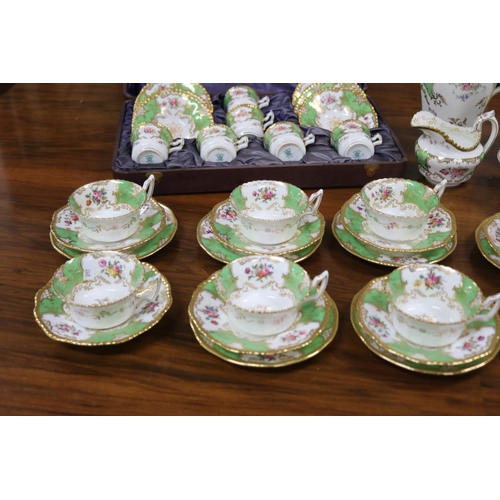 234 - Coalport afternoon coffee service decorated in apple green and gold with flower sprays comprising cu... 