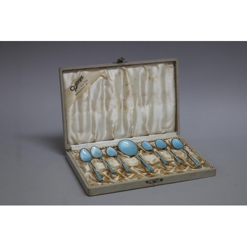 297 - Set of seven pale blue Egon Lauriden Danish silver enamelled spoons, in presentation case some with ... 