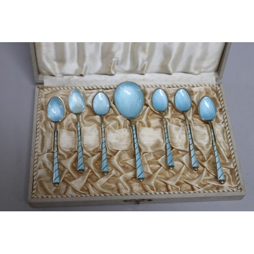 297 - Set of seven pale blue Egon Lauriden Danish silver enamelled spoons, in presentation case some with ... 