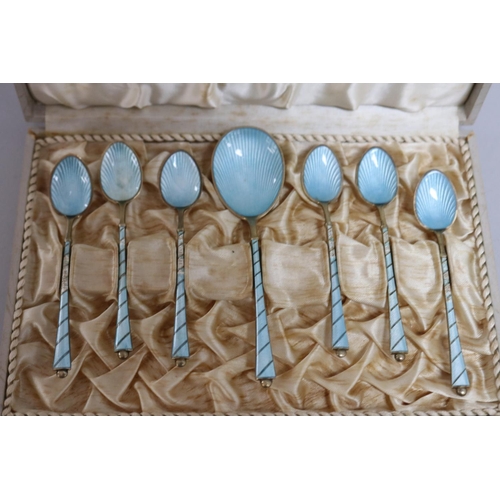 297 - Set of seven pale blue Egon Lauriden Danish silver enamelled spoons, in presentation case some with ... 