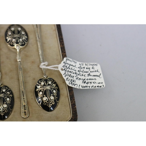 298 - Set of six hallmarked gilt sterling silver and black and white enamelled cased teaspoons, Birmingham... 