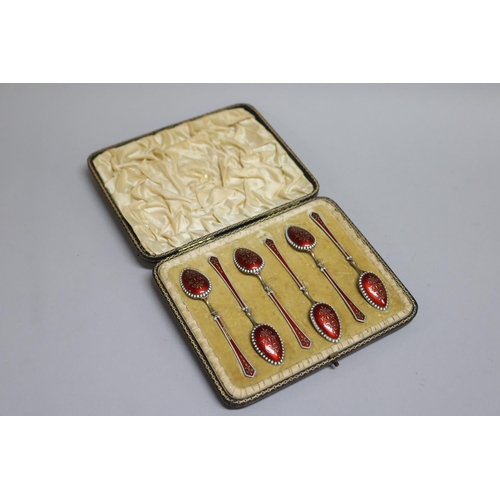 300 - Set of six antique gilt silver and red and white enamelled teaspoons, Birmingham 1896-97, with some ... 