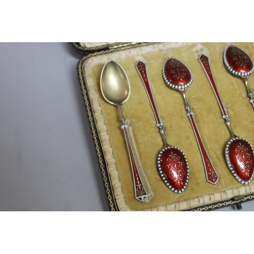 300 - Set of six antique gilt silver and red and white enamelled teaspoons, Birmingham 1896-97, with some ... 