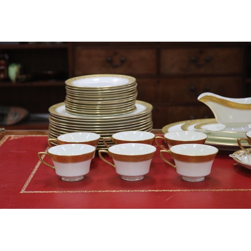 215 - Royal Worcester part dinner service with gilt borders comprising teacups, saucers, breakfast bowls, ... 