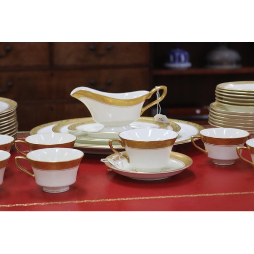 215 - Royal Worcester part dinner service with gilt borders comprising teacups, saucers, breakfast bowls, ... 