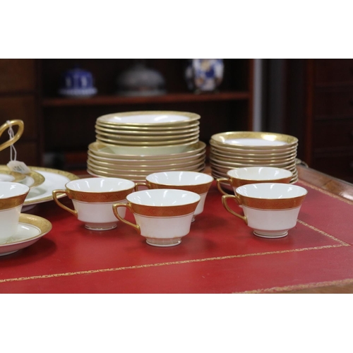 215 - Royal Worcester part dinner service with gilt borders comprising teacups, saucers, breakfast bowls, ... 