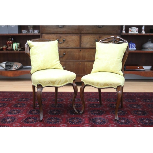 222 - Two similar Victorian walnut balloon back chairs in yellow damask upholstery (2)