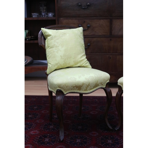 222 - Two similar Victorian walnut balloon back chairs in yellow damask upholstery (2)