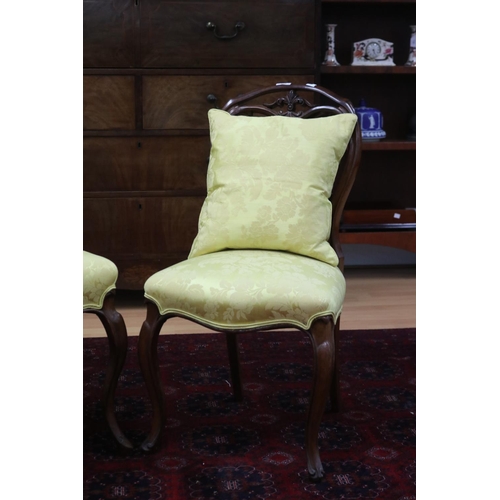 222 - Two similar Victorian walnut balloon back chairs in yellow damask upholstery (2)