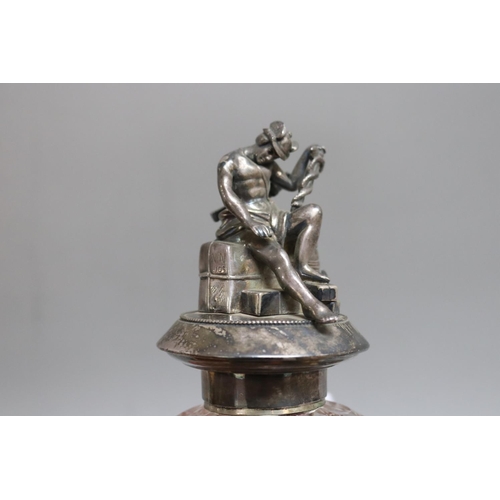 291 - Continental silver circular ink stand surmounted by a figure of Mercury, seated on a bale inscribed ... 