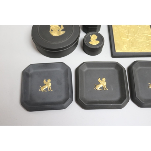 100 - Group of nine Wedgwood “Egyptian Collection” black and gilt basalt, including circular boxes, dishes... 