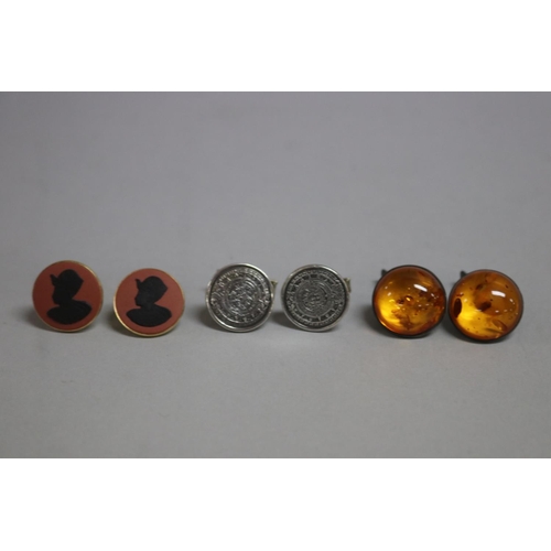 275 - Three pairs of cufflinks, Wedgwood, Mexico silver and  amber  (6)