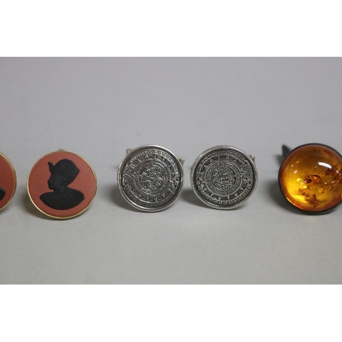 275 - Three pairs of cufflinks, Wedgwood, Mexico silver and  amber  (6)