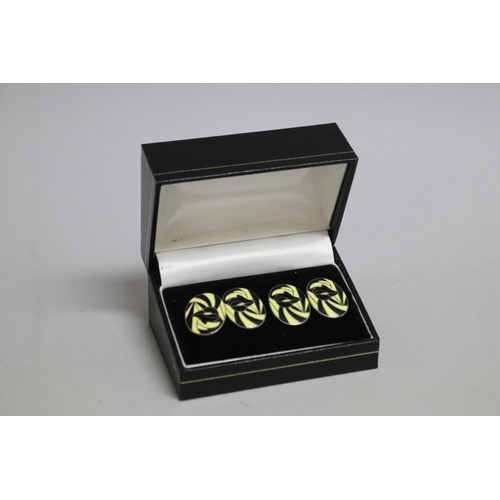 278 - Pair of silver, black and yellow cufflinks (2)