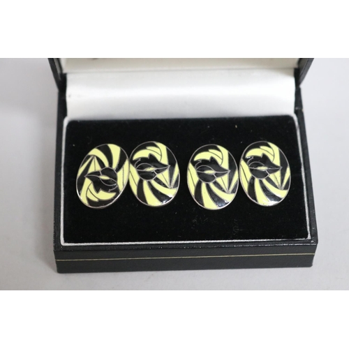 278 - Pair of silver, black and yellow cufflinks (2)
