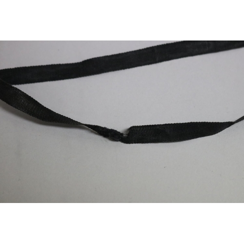 283 - Antique monocle on black ribbon, approx 4.5cm dia