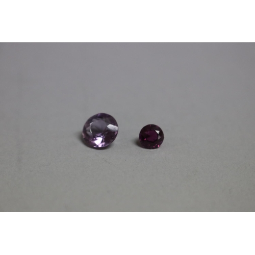 287 - Two unset stones, garnet and an amethyst (2)
