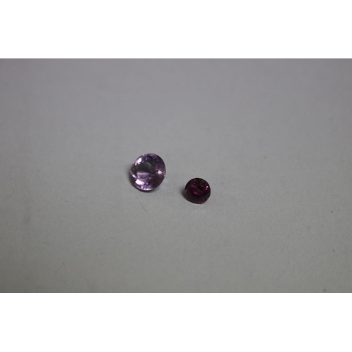 287 - Two unset stones, garnet and an amethyst (2)