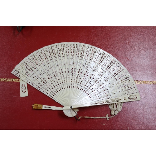 303 - Novelty fan set with a four leaf clover, a tortoiseshell fan, an ivorine fan and an ivory fan with s... 