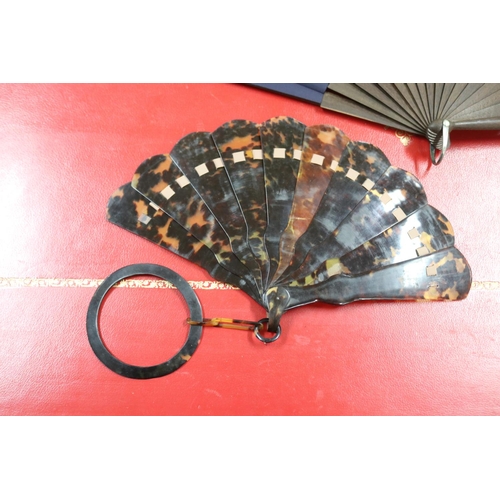 303 - Novelty fan set with a four leaf clover, a tortoiseshell fan, an ivorine fan and an ivory fan with s... 