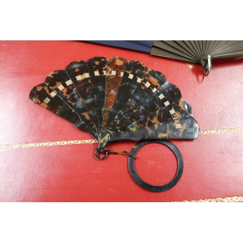 303 - Novelty fan set with a four leaf clover, a tortoiseshell fan, an ivorine fan and an ivory fan with s... 