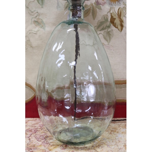 5067 - Glass bottle form lamp, unknown working order, approx 63cm H