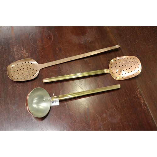 5102 - Three French copper utensils to include two strainers and one scoop, approx 49cm L and shorter (3)