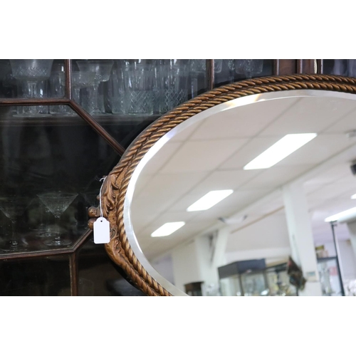 354 - Vintage oval form wall mirror with a rope twist and leaf design, approx 89cm x 51cm