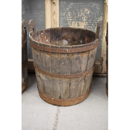 5151 - Antique French twin handled wooden barrel with iron strapping, in distressed condition and can possi... 
