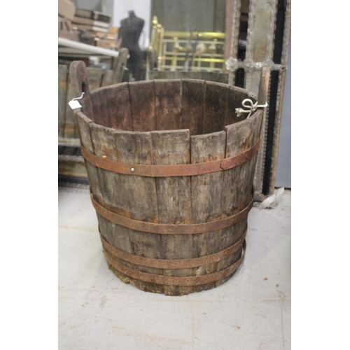 5152 - Antique French twin handled wooden barrel with iron strapping, in distressed condition and can possi... 