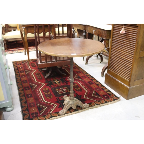 5201 - French cast iron based bistro table with circular wooden top, approx 71cm H x 63cm Dia