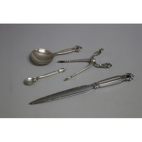 182 - Georg Jensen Acorn pattern letter opener, caddy spoon, sugar nips and an Agapanthus mustard spoon (4... 