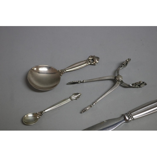 182 - Georg Jensen Acorn pattern letter opener, caddy spoon, sugar nips and an Agapanthus mustard spoon (4... 