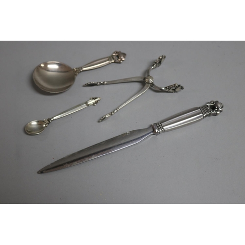 182 - Georg Jensen Acorn pattern letter opener, caddy spoon, sugar nips and an Agapanthus mustard spoon (4... 