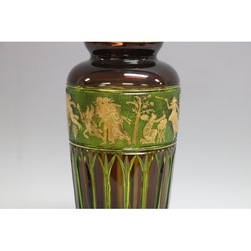 358 - Rare green and dark amber Moser double cased glass vase with a gilt band of classical figures by Lud... 