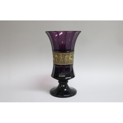 359 - Moser amethyst flared rim pedestal vase with a central brass band collar with figures in low relief,... 