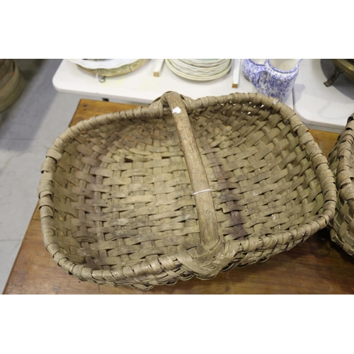 5280 - Two French woven baskets, approx 18cm H (excluding handle) x 56cm W x 35cm D & smaller (2)