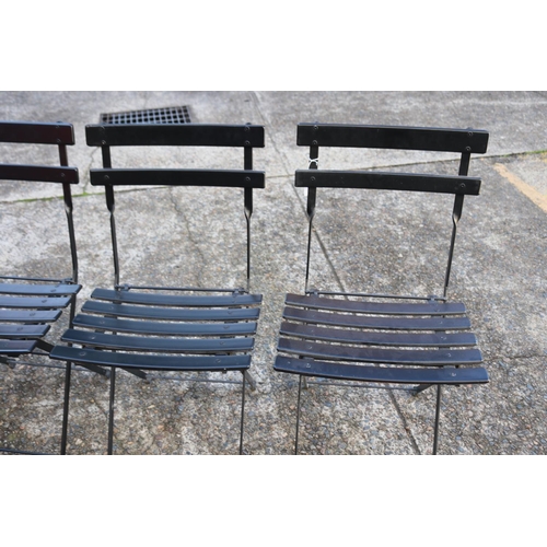 5260 - Four black folding chairs (4)