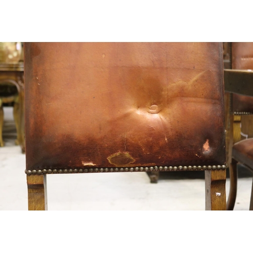 49 - Set of six French oak framed studded leather high back dining chairs, showing distressing to leather... 