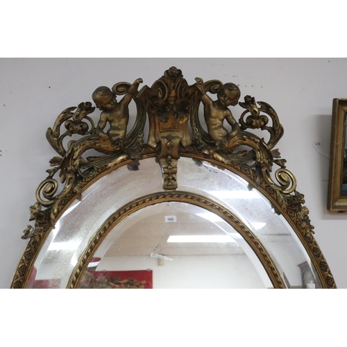 73 - Impressive antique French gilt salon mirror, sectional design, with elaborate crest flanked by a pai... 