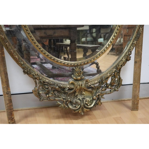 73 - Impressive antique French gilt salon mirror, sectional design, with elaborate crest flanked by a pai... 