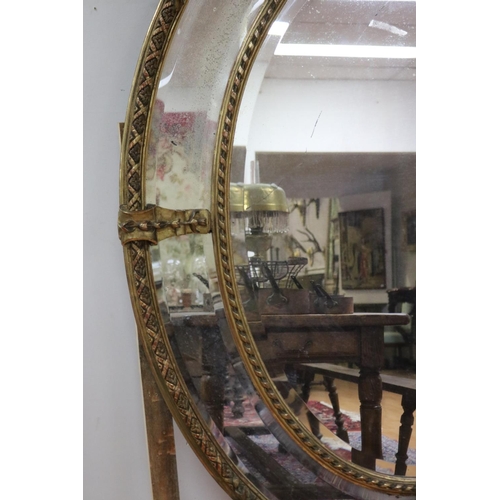 73 - Impressive antique French gilt salon mirror, sectional design, with elaborate crest flanked by a pai... 