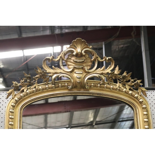 101 - Fine antique French gilt surround arched top salon mirror, with elaborate scrolling pierced crest, a... 