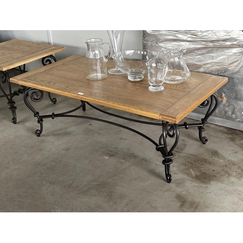 404 - Quality oak topped hand forged wrought iron based coffee table, approx 48cm H x 130cm L x 71cm W
