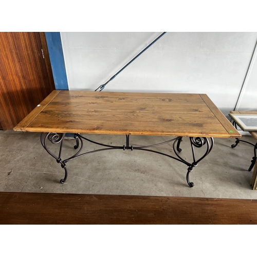 405 - Good quality long oak topped dining table, with hand forged elaborate wrought iron base, approx 78cm... 