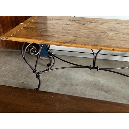 405 - Good quality long oak topped dining table, with hand forged elaborate wrought iron base, approx 78cm... 