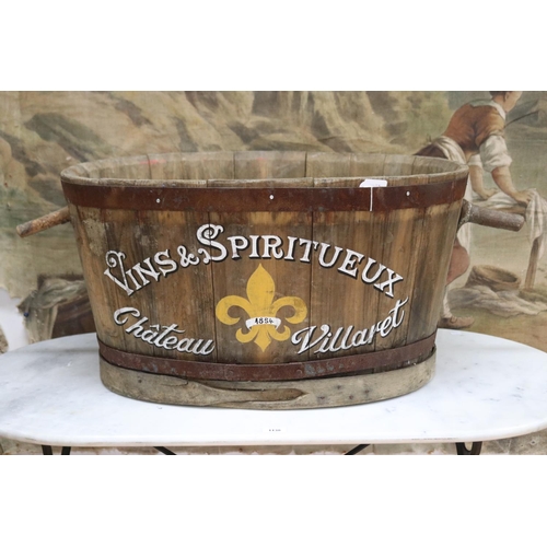 Antique French wine makers grape tub of oval shape, branch handles, later painted with Vins & Spiritueux Chateau Villaret 1854, approx 40cm H x 76cm W x 55.5cm D (excluding handle)