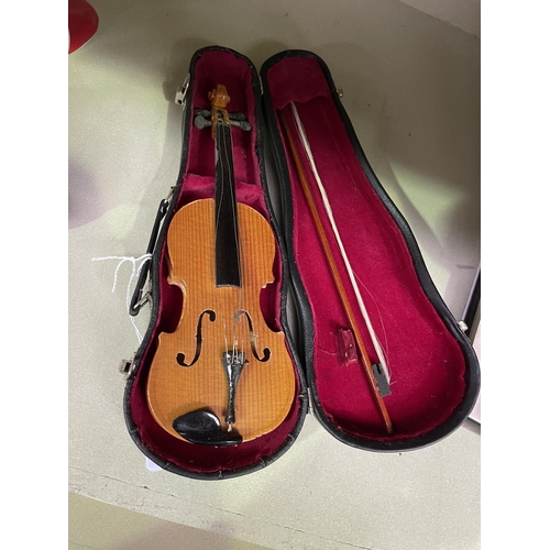 34 - Cased miniature violin,  approx 8 cm D 22 cm W.